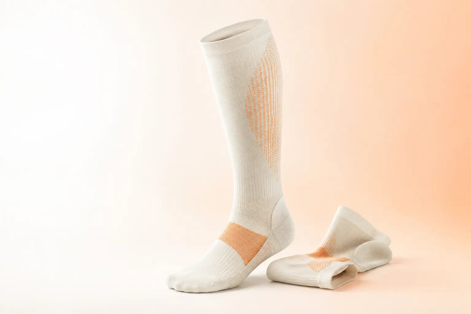 R1 tall recovery sock concept with orange knit zones